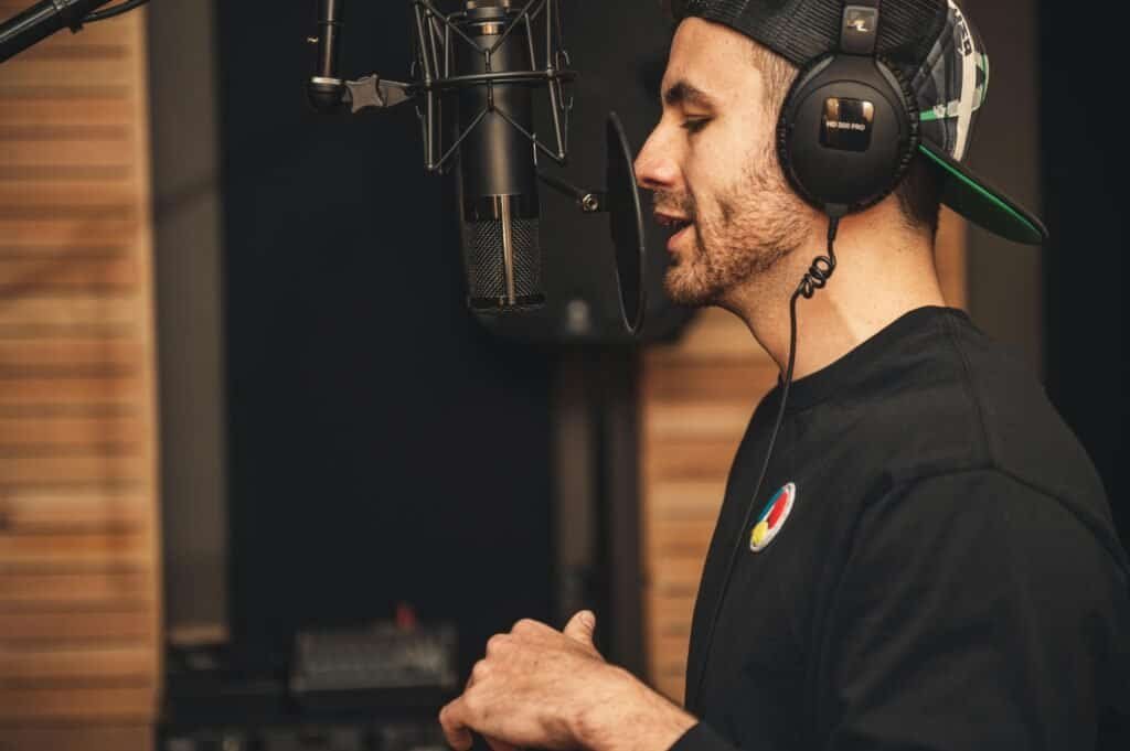 Singer With Headphones In a Studio